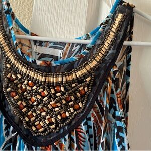 Long dress needs a new loving home .has great bead work !